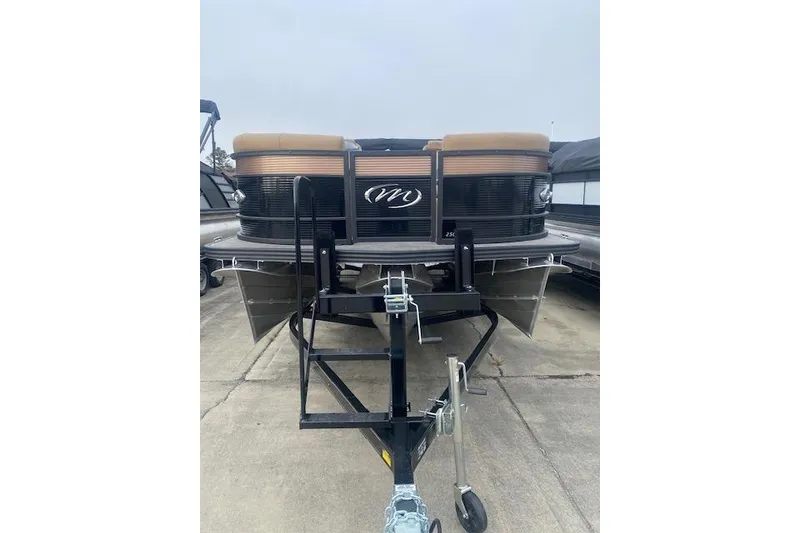 Slide: The Image of 2026 Manitou 25 Encore RF VPII pontoon boat on trailer, front view. - 3