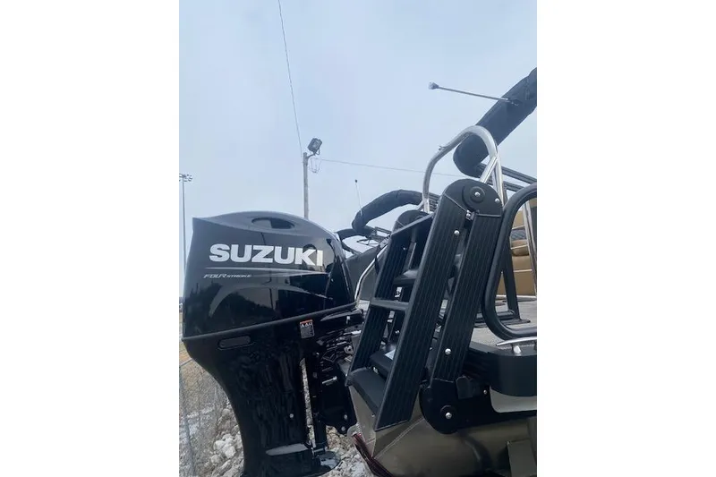 Slide: The Image of 2026 Manitou 25 Encore RF VPII with Suzuki outboard motor and ladder. - 5