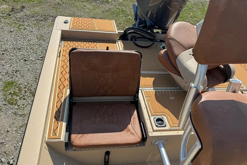 Slide: The Image of 2026 G3 Bay 19 GX boat interior with brown seating and deck details. - 19