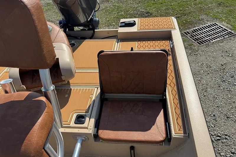 Slide: The Image of 2026 G3 Bay 19 GX boat interior with brown leather seats and deck details. - 20