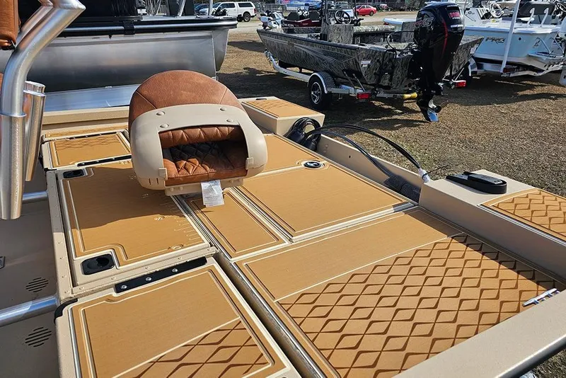 Slide: The Image of 2026 G3 Bay 19 GX boat deck with tan diamond-patterned flooring and cushioned seat. - 25