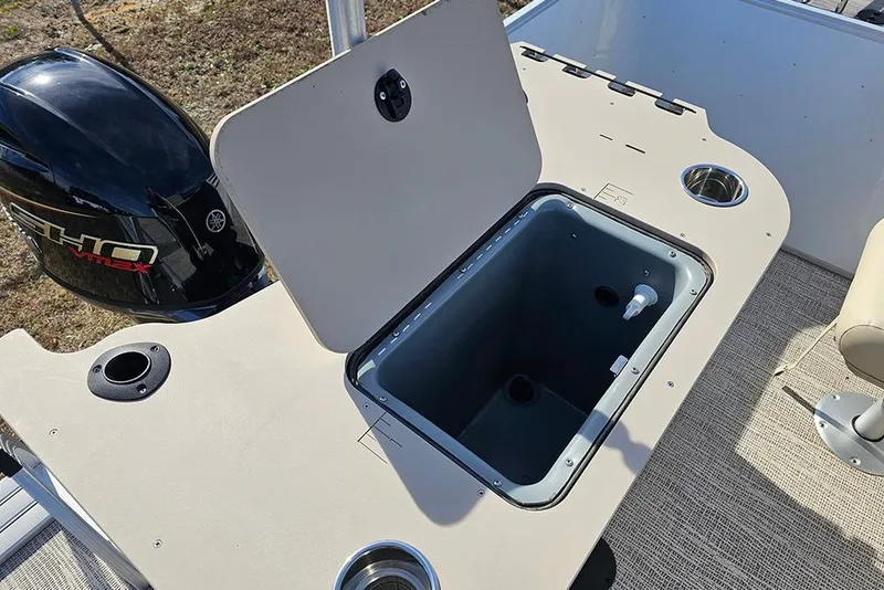 Slide: The Image of 2026 SunCatcher Select 22RF boat with open storage compartment and Yamaha VMAX engine. - 10