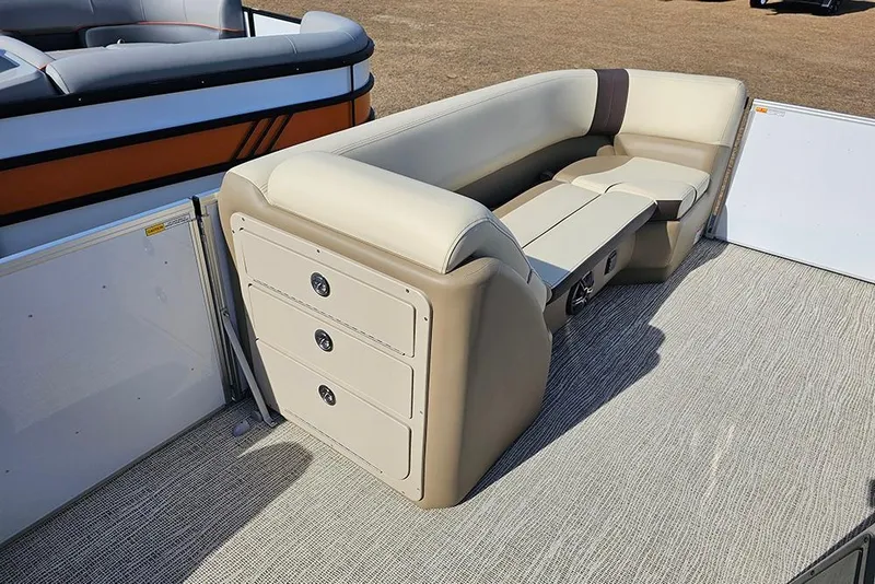 Slide: The Image of 2026 SunCatcher Select 22RF pontoon boat with beige seating and storage compartments. - 13