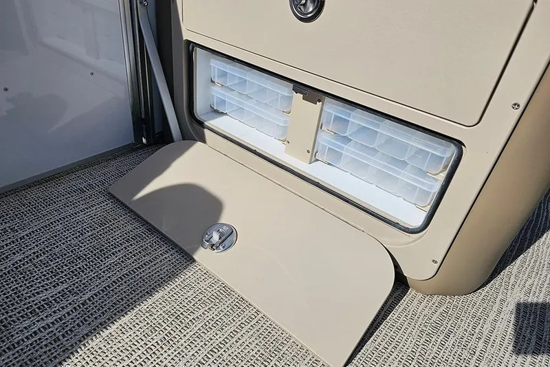 Slide: The Image of 2026 SunCatcher Select 22RF storage compartment with organized containers on textured flooring. - 15