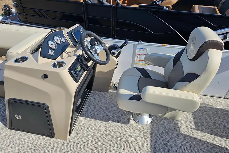 Slide: The Image of 2026 SunCatcher Select 22RF boat interior with steering console and captain's chair. - 16