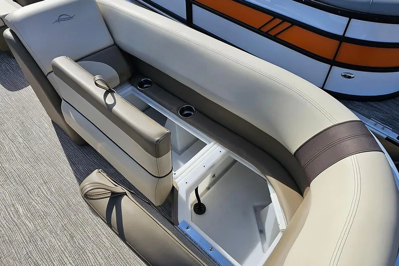 Slide: The Image of 2026 SunCatcher Select 22RF boat interior with beige seating and storage compartments. - 21