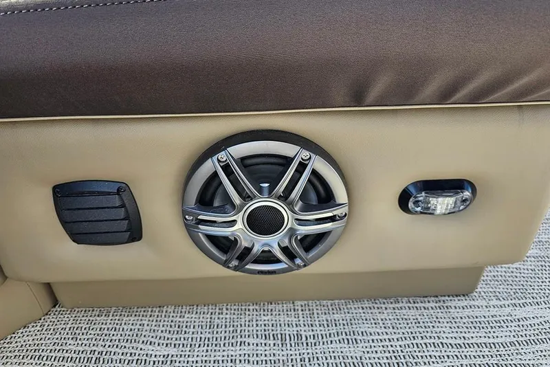 Slide: The Image of 2026 SunCatcher Select 22RF boat interior with speaker and light detail. - 22