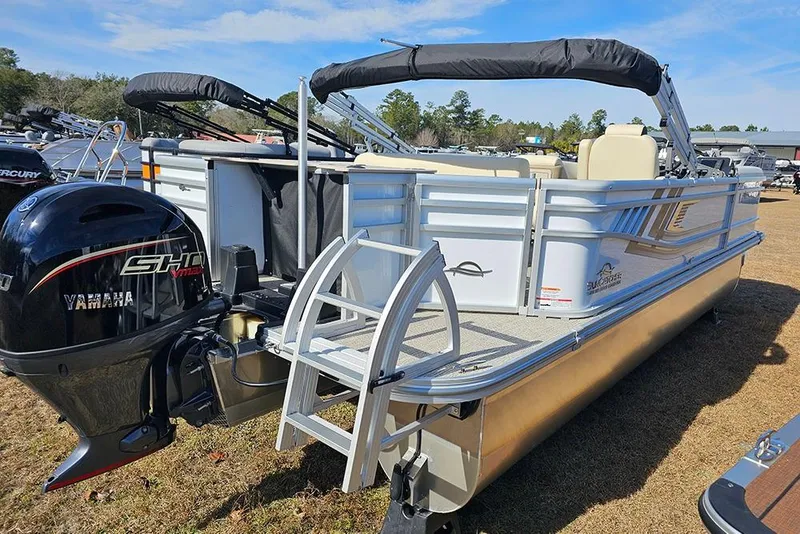 Slide: The Image of 2026 SunCatcher Select 22RF pontoon boat with Yamaha outboard motor, parked on grass. - 6