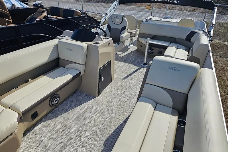 Slide: The Image of 2026 SunCatcher Select 22RF pontoon boat interior with beige seating and modern design. - 8