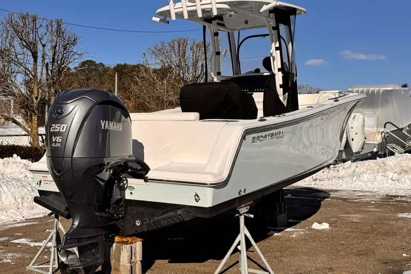 Slide: The Image of 2023 Sportsman Open 232 Center Console boat with Yamaha 250 V6 engine, parked on stands. - 5
