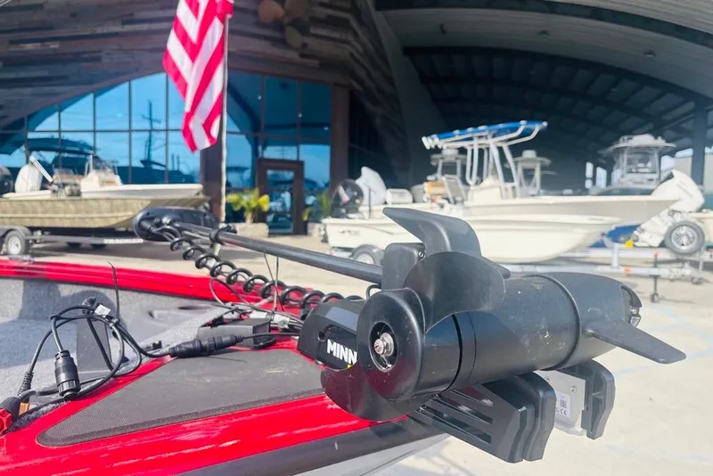 Slide: The Image of 2025 Tracker Pro Team 175 Crappie Edition boat with trolling motor, American flag in background. - 13
