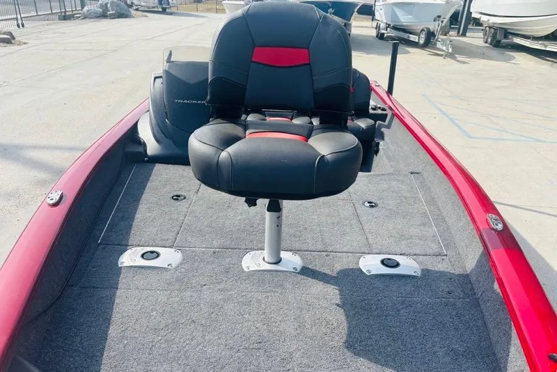 Slide: The Image of 2025 Tracker Pro Team 175 Crappie Edition boat with red trim and swivel seat. - 14