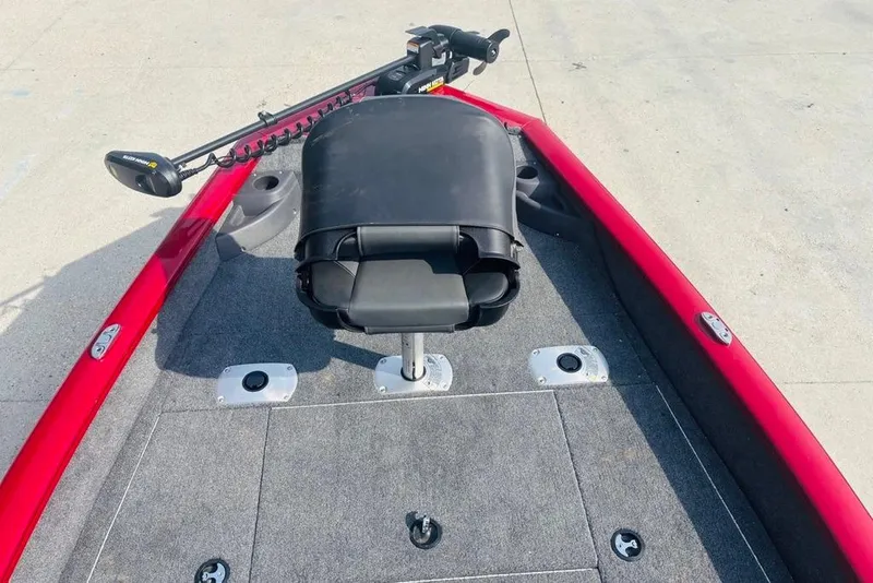 Slide: The Image of 2025 Tracker Pro Team 175 Crappie Edition boat with red trim and fishing seat. - 18