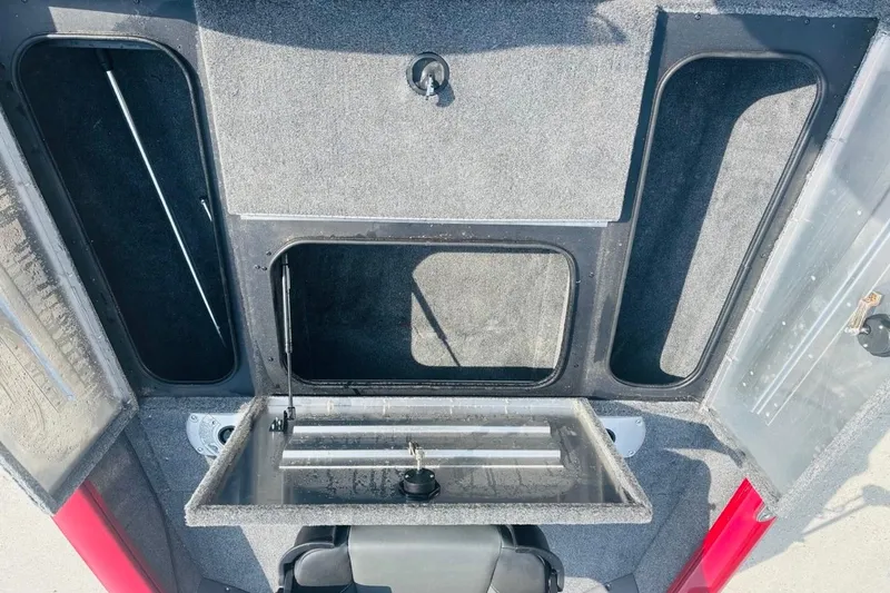 Slide: The Image of 2025 Tracker Pro Team 175 Crappie Edition boat storage compartments, open view. - 20