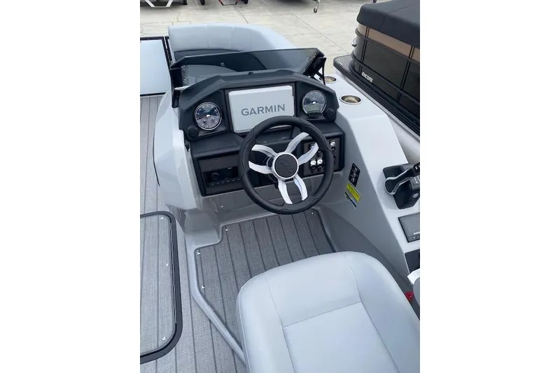 Slide: The Image of 2026 Manitou 23 Encore RF SHP boat dashboard with Garmin navigation system. - 15