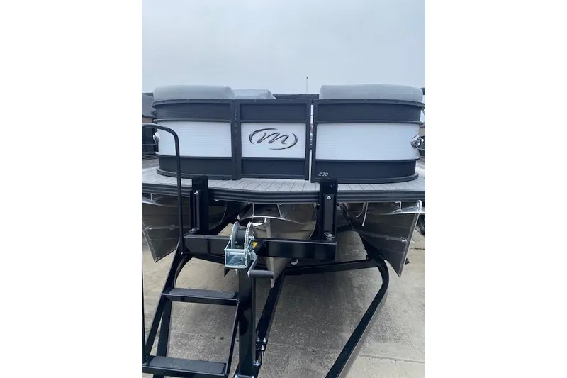 Slide: The Image of 2026 Manitou 23 Encore RF SHP pontoon boat rear view with ladder. - 4