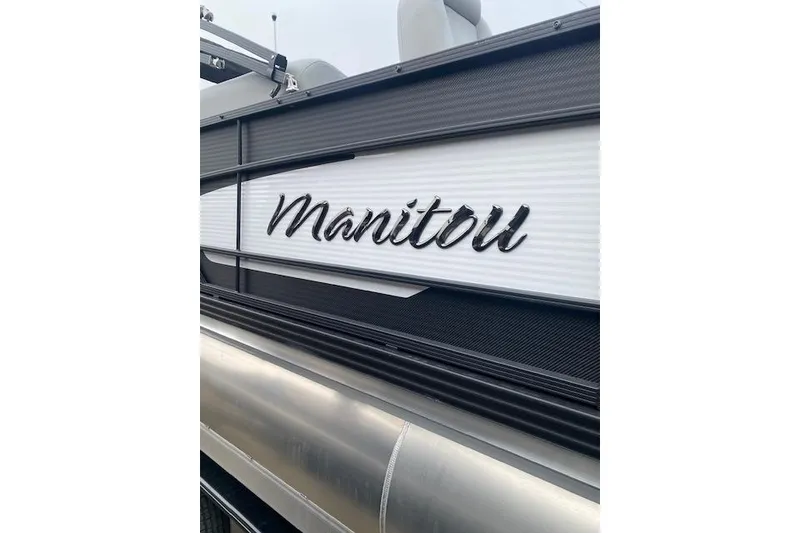 Slide: The Image of 2026 Manitou 23 Encore RF SHP pontoon boat with sleek design details. - 7