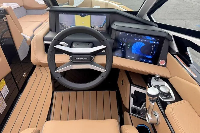 Slide: The Image of 2026 MasterCraft X24 boat dashboard with advanced controls and digital displays. - 12