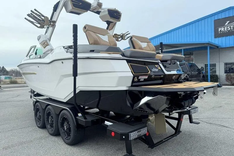 Slide: The Image of 2026 MasterCraft X24 boat on trailer, featuring sleek design and modern amenities. - 3