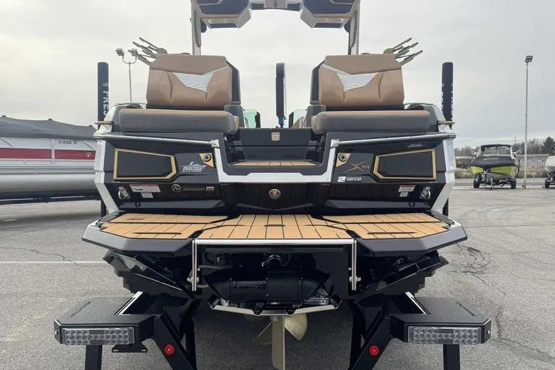 Slide: The Image of 2026 MasterCraft X24 boat rear view with teak platform and seating. - 5