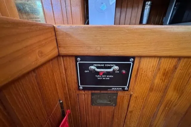 Slide: The Image of Propane control panel on 1986 Fairweather Mariner 39 boat with wooden interior. - 17