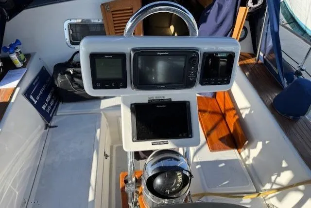 Slide: The Image of Cockpit of 1986 Fairweather Mariner 39 with navigation instruments and compass. - 20