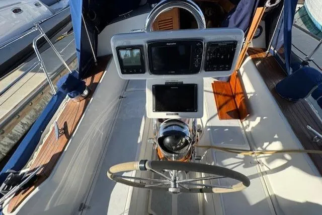 Slide: The Image of Cockpit of 1986 Fairweather Mariner 39 sailboat with navigation equipment and steering wheel. - 21