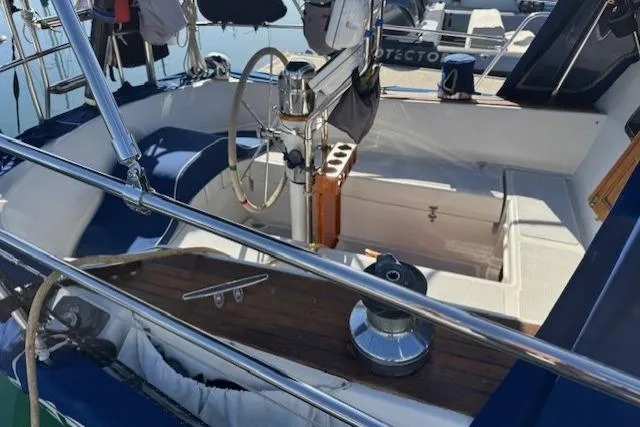 Slide: The Image of 1986 Fairweather Mariner 39 sailboat cockpit with steering wheel and winch. - 22