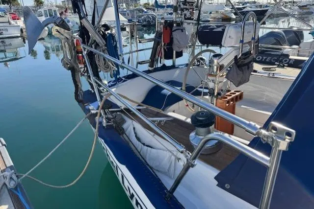 Slide: The Image of 1986 Fairweather Mariner 39 sailboat docked in marina, featuring deck and rigging details. - 23