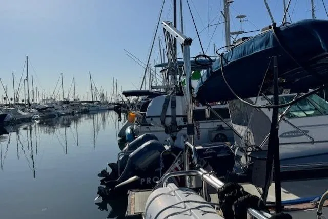 Slide: The Image of Marina with 1986 Fairweather Mariner 39 sailboat docked among other vessels. - 29
