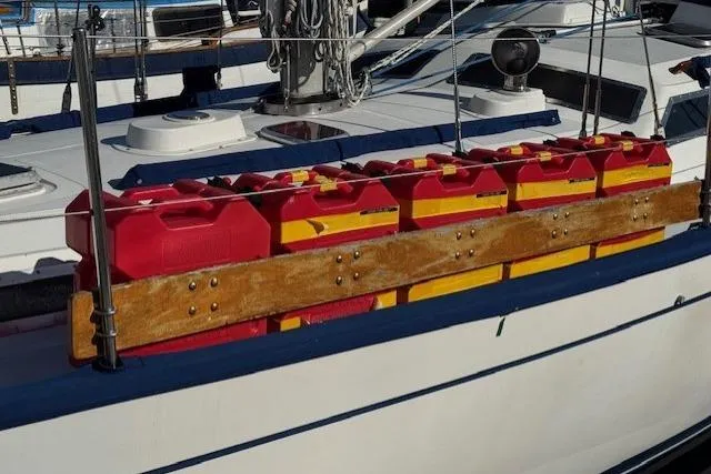 Slide: The Image of Red and yellow fuel containers on 1986 Fairweather Mariner 39 sailboat deck. - 41