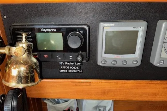 Slide: The Image of Control panel of 1986 Fairweather Mariner 39 with navigation instruments and brass lamp. - 6