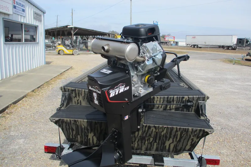 Slide: The Image of 2026 Gator Tail 1854 Extreme boat with powerful outboard motor in a dealership lot. - 5