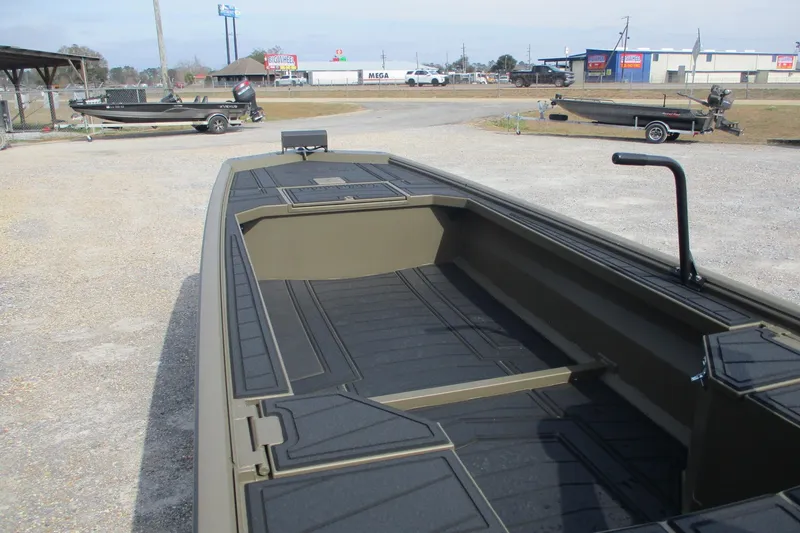 Slide: The Image of 2026 Gator Tail 1854 Extreme boat, olive green, parked outdoors on gravel. - 7