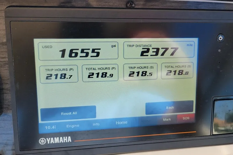 Slide: The Image of Yamaha display showing fuel usage and trip data for 2019 Grady-White Freedom 307. - 13