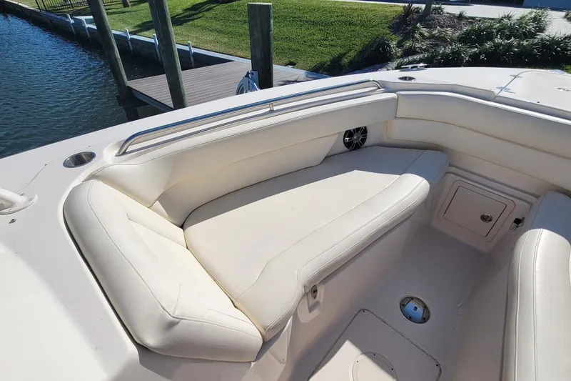 Slide: The Image of 2019 Grady-White Freedom 307 boat with spacious white seating area. - 16