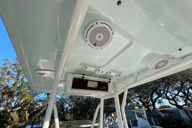Slide: The Image of 2019 Sea Hunt BX 22 BR boat T-top with speakers and storage compartment. - 10