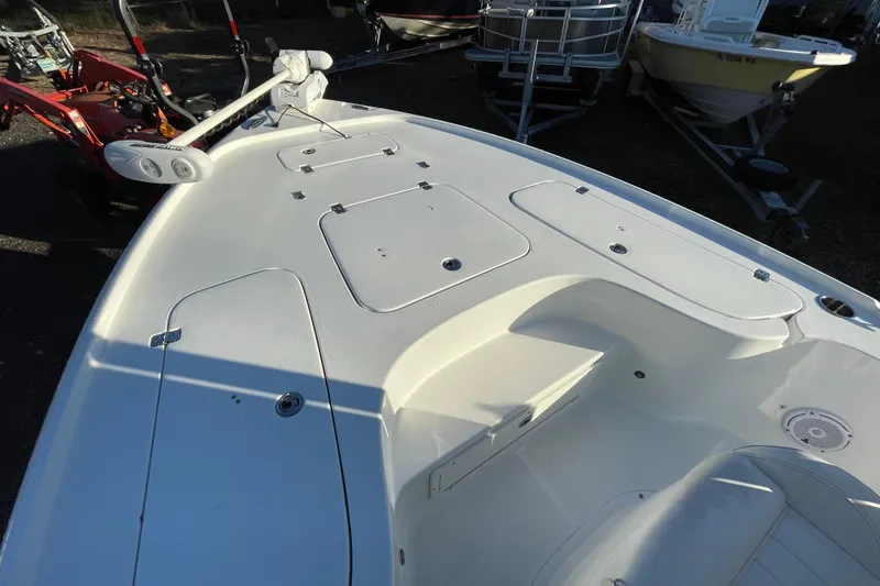 Slide: The Image of 2019 Sea Hunt BX 22 BR boat deck with storage compartments and trolling motor. - 13