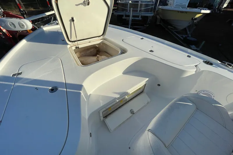 Slide: The Image of 2019 Sea Hunt BX 22 BR boat interior with open storage compartments. - 14