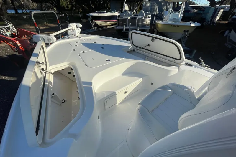 Slide: The Image of 2019 Sea Hunt BX 22 BR boat interior with open storage compartments and seating. - 15