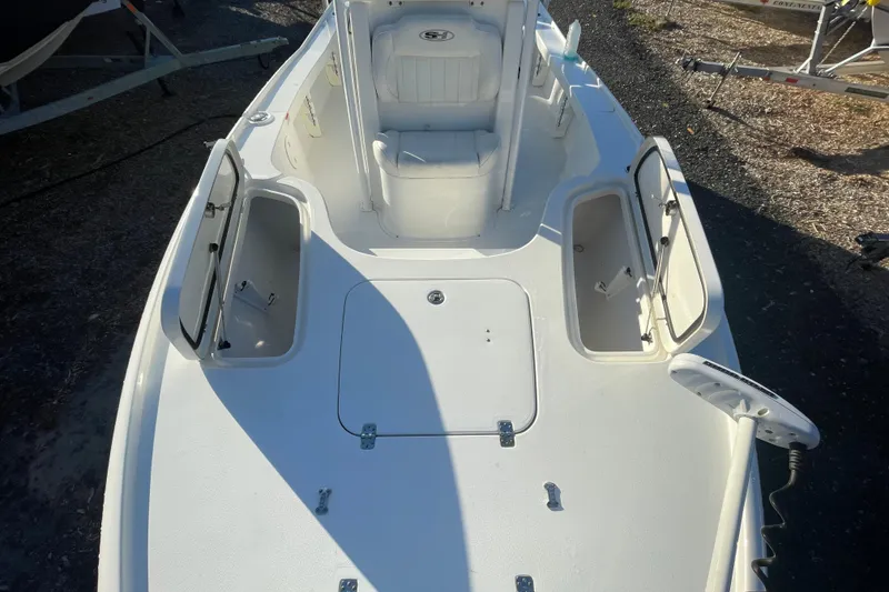 Slide: The Image of 2019 Sea Hunt BX 22 BR boat deck with open storage compartments. - 17