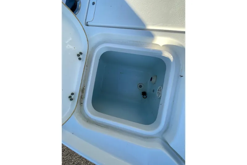 Slide: The Image of 2019 Sea Hunt BX 22 BR boat storage compartment, open and empty. - 6