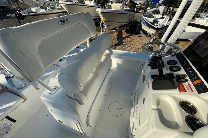 Slide: The Image of 2019 Sea Hunt BX 22 BR boat interior with steering wheel and seating. - 7