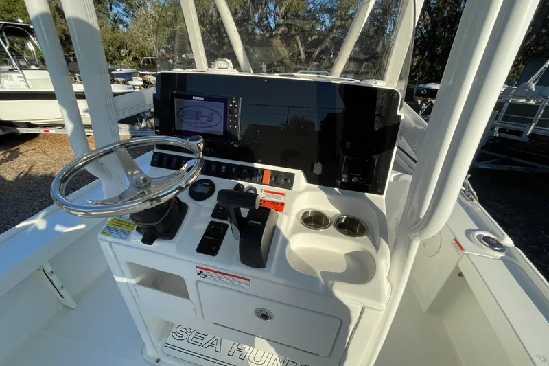 Slide: The Image of 2019 Sea Hunt BX 22 BR boat console with steering wheel and navigation display. - 8