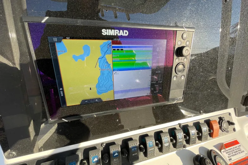 Slide: The Image of Simrad navigation display on 2019 Sea Hunt BX 22 BR boat dashboard. - 9