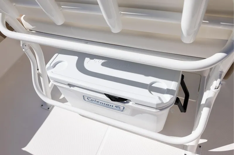 Slide: The Image of 2023 Robalo 246 Cayman boat with Coleman cooler under seat. - 11