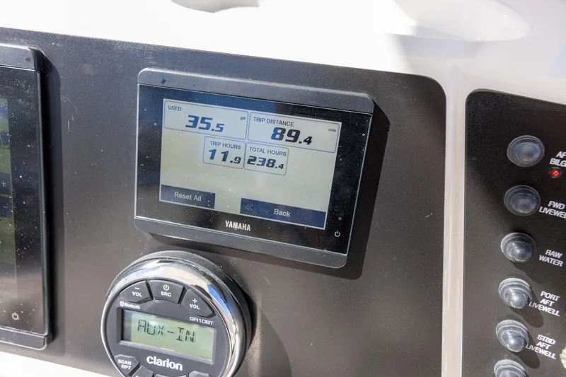 Slide: The Image of Dashboard of 2023 Robalo 246 Cayman boat with Yamaha display and controls. - 15