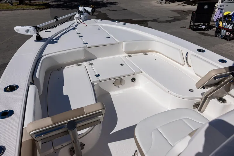 Slide: The Image of 2023 Robalo 246 Cayman boat interior with seating and storage compartments. - 16