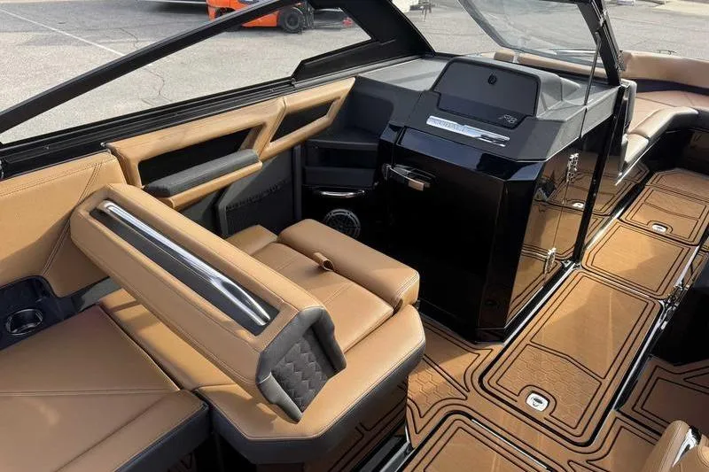 Slide: The Image of 2026 Cobalt R8 Surf boat interior with luxurious tan seating and modern dashboard design. - 11