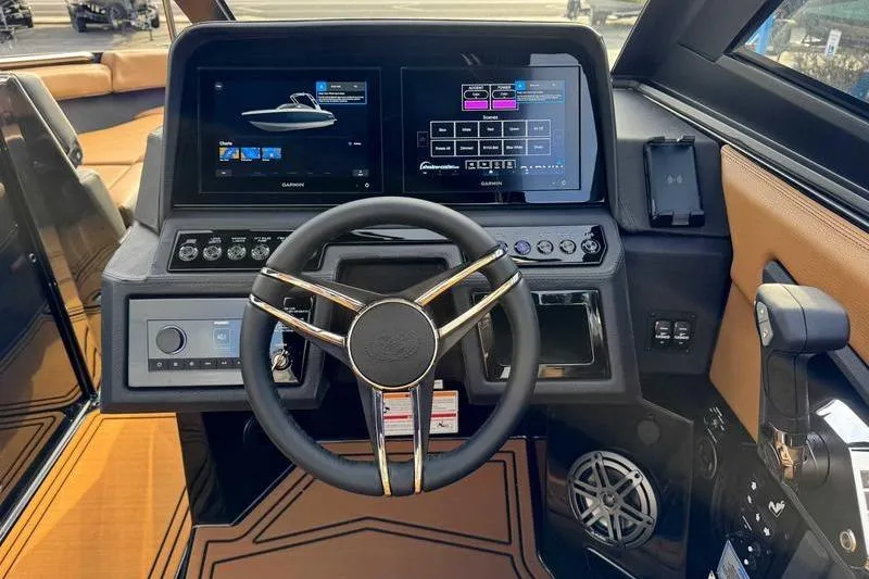 Slide: The Image of 2026 Cobalt R8 Surf dashboard with dual screens and modern steering wheel. - 12